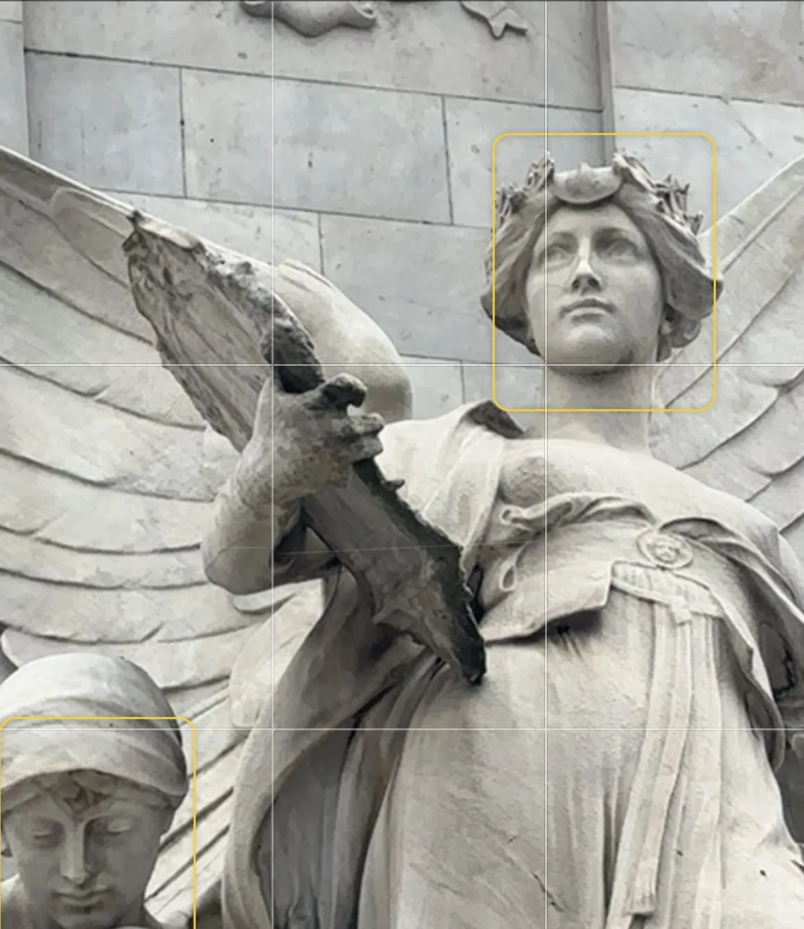 iPhone camera viewfinder aimed at two angel sculptures