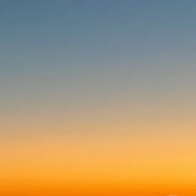 Half blue, half orange sunset gradient